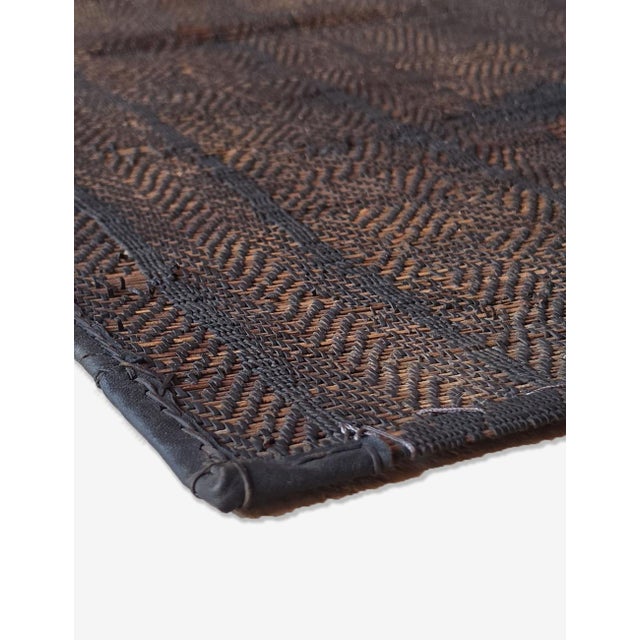 Vintage Small Tuareg Mat | Handwoven Reed Mauritanian Mat with Diamond Patchwork Design This vintage Tuareg mat features a...