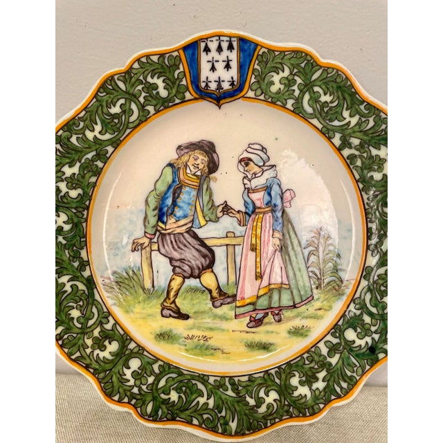 A good 19th century French Porquier Beau Quimper Plate with a dark green border depicting a courting scene. Good details...