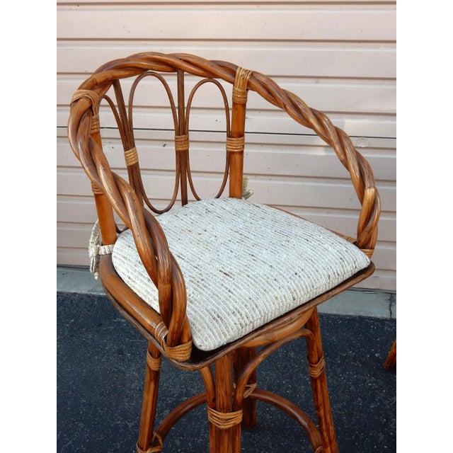 Sculpted twisted cane & rattan counter height bar stools. Solid and very comfortable. They swivel in the center. Made in...