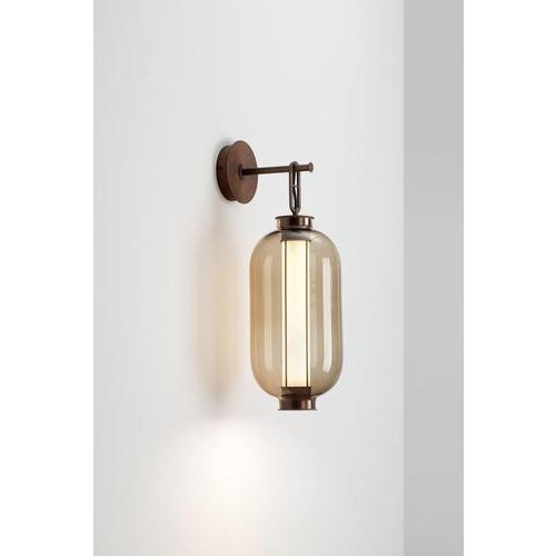 Bai a ba ba - indoor wall lamp. Structure in bronze electroplated steel. Diffuser in blown transparent, amber and grey...