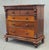 A monumental antique circa 1870, high Victorian period, flame mahogany chest of drawers from Scotland in original, as...