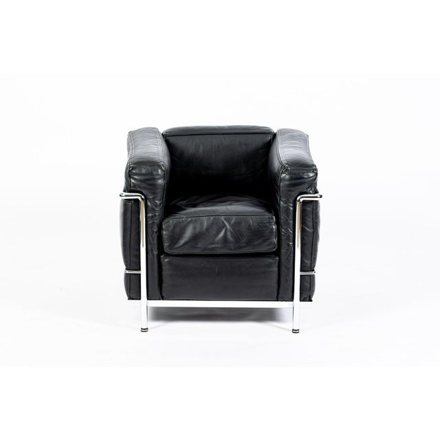 This authentic LC2 Petit Modele black leather armchair originally designed by Le Corbusier, Charlotte Perriand and Pierre...