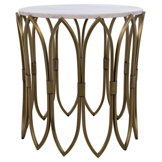 Ribbons of slim but strong bands of metal gracefully support a stone top in this lovely table. The metal is given a softly...