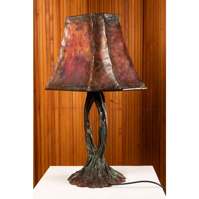 Sculptural table lamp, second half of the 20th century. A unique piece, handcrafted in worked and patinated copper, with a...
