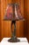 Sculptural table lamp, second half of the 20th century. A unique piece, handcrafted in worked and patinated copper, with a...