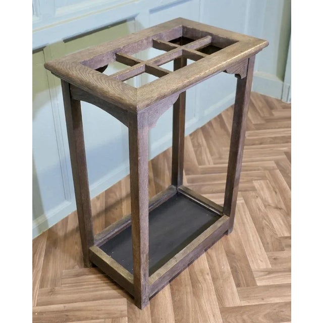 A good Sturdy Arts and Crafts Oak Stick or Umbrella Hall Stand The stand is made in Oak, it has straight uprights, the top...