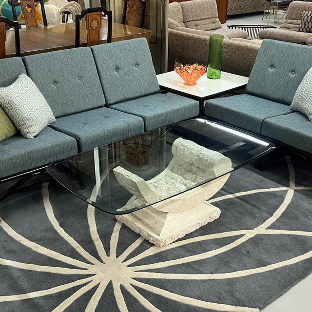Elegantly curved tessellated stone coffee table. The table base is made of Mactan stone, a type of coral. It seems fitting...
