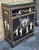A Chinese Mother of Pearl and Hardstone Decorated Lacquered Side Cabinet. Protective glass top. Adjustable shelf. Measure...