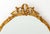 Louis XVI Style Giltwood Framed Oval Beveled Glass Mirror. Mirror plate: 29" H x 23.5" W; frame: 36" H x 26.5" W....