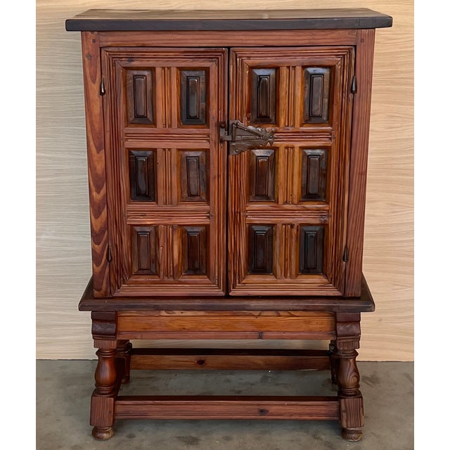 19th Catalan Spanish Baroque carved walnut Tuscan two door cabinet. From the north of Spain, built in solid walnut, the...