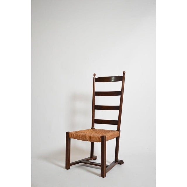 Wood and straw low chair, 1950s. Height: 104 cm - 40.94 in Length: 47 cm - 18.5 in Width: 50 cm - 19.69 in