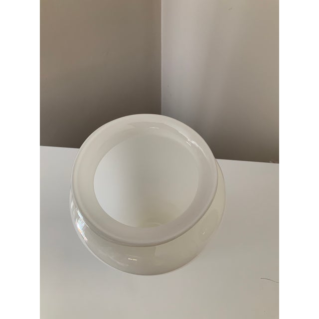 This tall and elegant vase is a beautiful and shiny white vases glass. This vase has lovely curves and would be a fabulous...