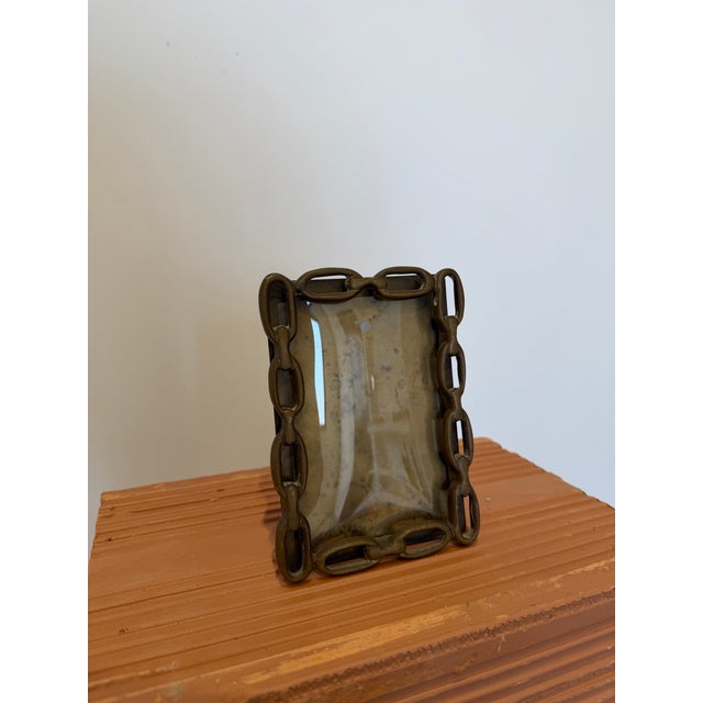 Brazilian mid-century modern chainlink bronze picture frame circa 1960s. The frame has an inset transparent acrylic photo...