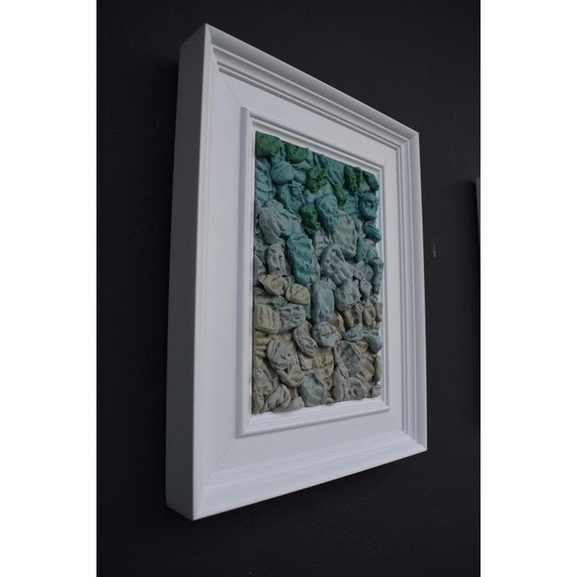 This wall-mounted pop sculpture by María Magán consists of dozens of hand-molded silicone forms arranged in a dense...