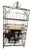Substantial freestanding wrought iron baker's rack or kitchen storage cabinet featuring an ornate architectural frame with...