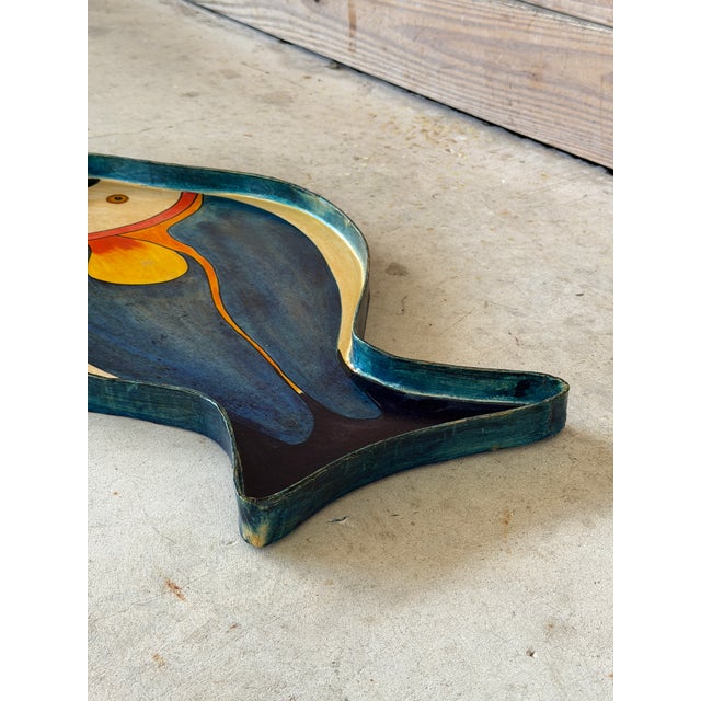 Bring a splash of coastal charm to your entertaining with this vintage hand-painted papier-mâché fish serving tray,...