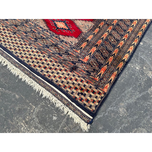 This hand-knotted Pakistani Turkomen patten rug uses natural colors and handspun wool. This lovely rug will enhance your...