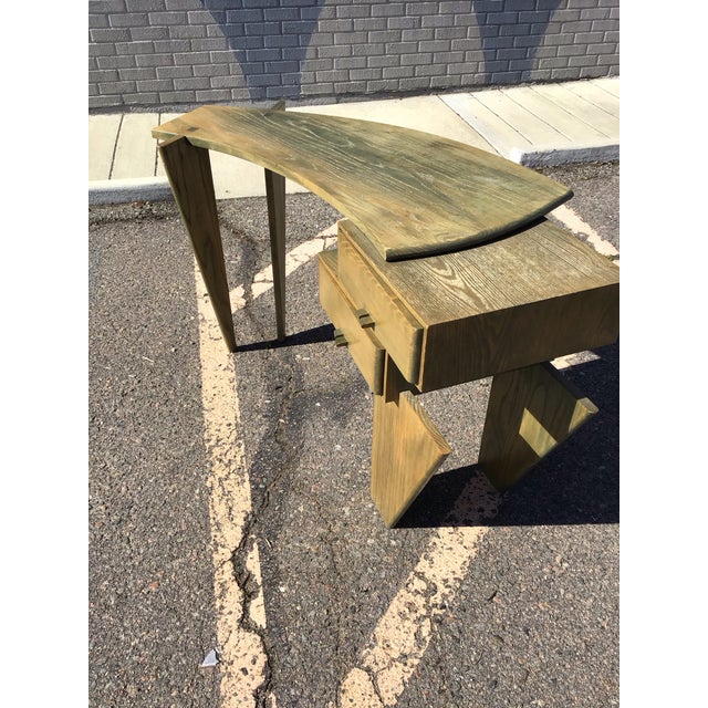 Striking mid-century modern desk featuring an uncommon asymmetrical silhouette and sculptural design. Crafted in oak with...