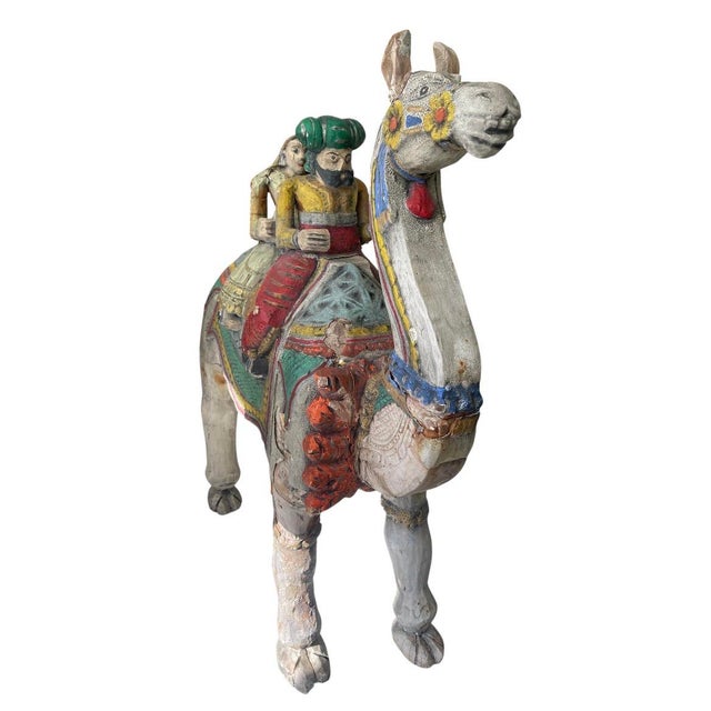 Bring a sense of rich, global history to your space with this captivating vintage carved wood sculpture from India. Hand-...