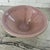 Spectacular hand blown glass bowl in the style of murano. No signature noted. Features a pale pink interior and lip with a...