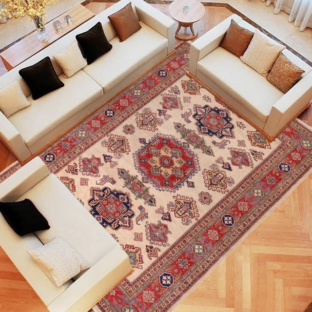 Enhance your home with this exquisite hand-knotted Super Kazak rug, crafted from fine hand-spun wool and dyed with all-...