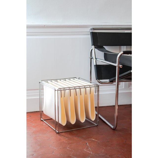 Sleek, refined, and a collector's item, this magazine rack is the Isocèle model by French sculptor and designer Max Sauze,...