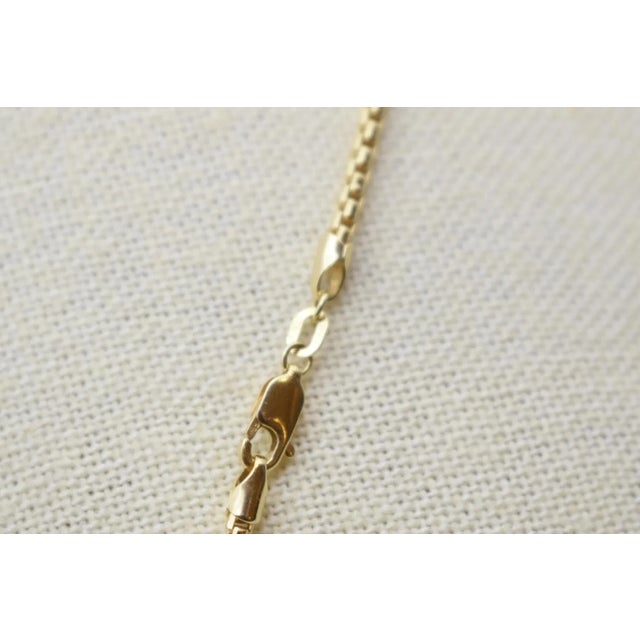 This is a beautiful 18" yellow gold box chain. It is marked Italy, 585, 14k.