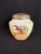 This is an unmarked late 19th century - 1880-1900 - hand-decorated porcelain vase with a "frog" flower grid. Note the lady...