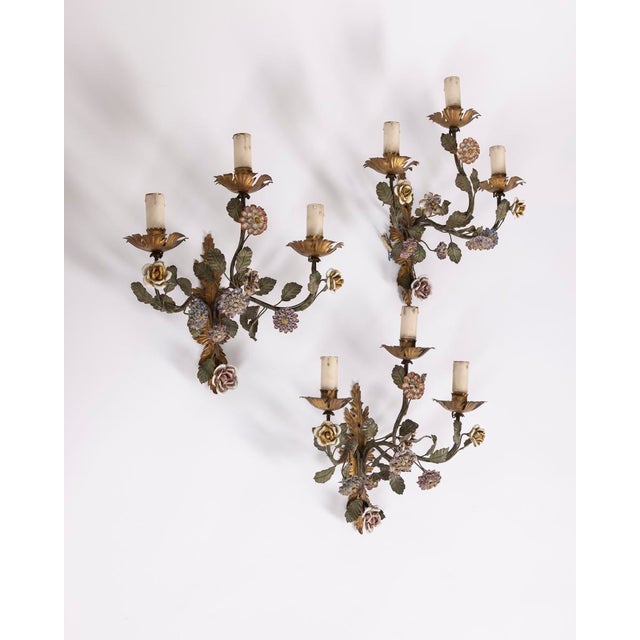 Set of three floral-style wall lamps, made of iron with porcelain details, Italian design, 1950s. Up to 250V (Europe/UK...