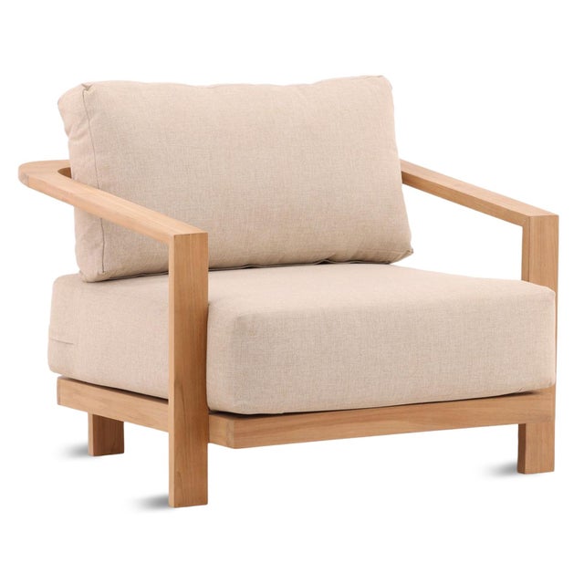 Natural teak frame outdoor arm chair with sand/beige performance olefin fabric cushions. Each chair may vary in exact...