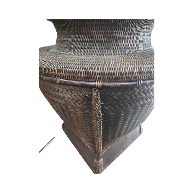 Striking large-scale handwoven basket vessel featuring an exceptional tight weave and sculptural, architectural form....