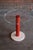 A vintage, post-modern drinks table featuring a glass top on a red metal and travertine stone base. In excellent...