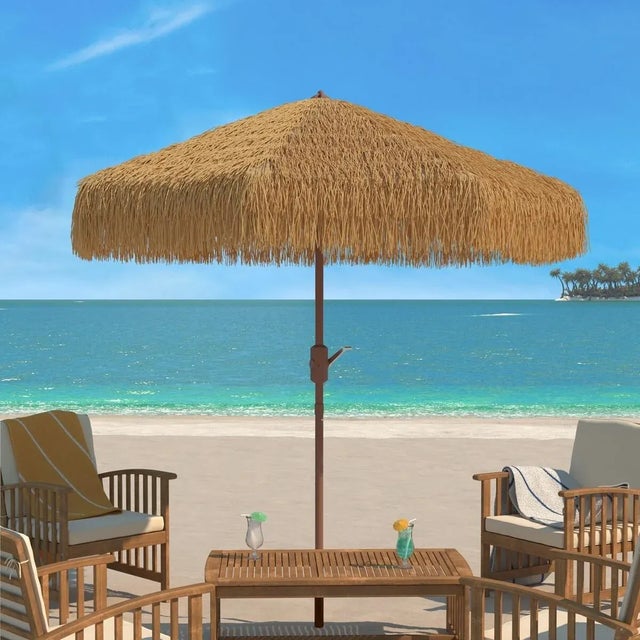 Give a resort-inspired look to your outdoor spaces with our Nemery Tiki umbrella. Our thatched, tropical-inspired umbrella...