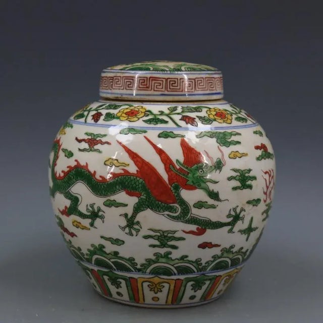 H-17.6cm,W-17.2cm This vintage Famille Verte porcelain tea jar from China features a hand-painted cloud dragon pattern,...