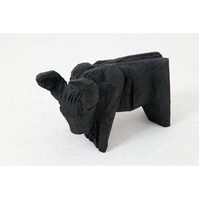 This unique sculptural animal is a one of a kind art piece, carved from a single piece of wood to ensure a monolithic and...