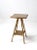 An antique painted wooden side table with a distinctive metallic gold finish. The petite table features turned splay legs...