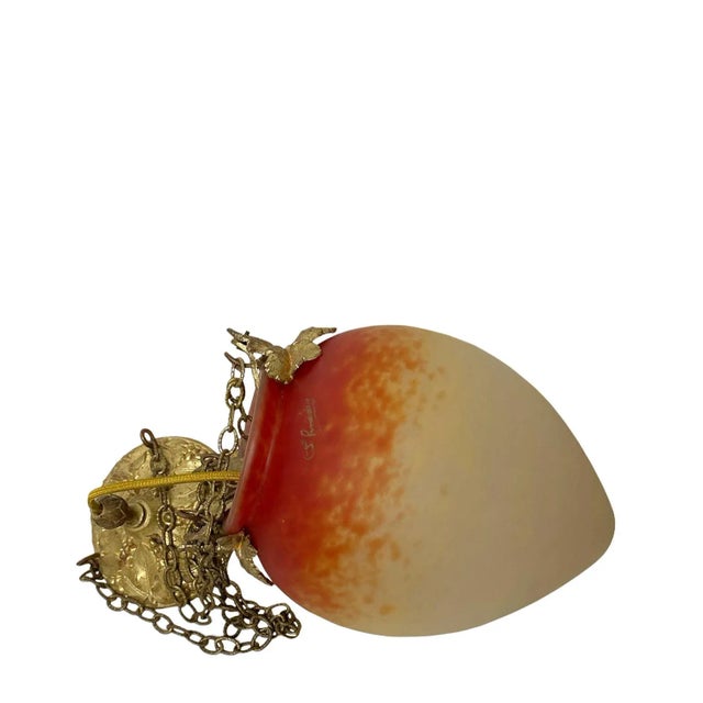 A 1900s Art Nouveau glass lamp by Schneider with bronze dore leaves and fittings also with its original cap. The glass is...