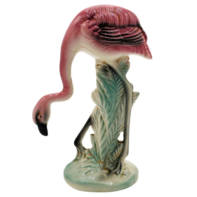Mid-century pink and green Drinking flamingo ceramic figurine. The statue detailed a pink flamingo with long legs, a slim,...