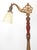 Victorian style bridge arm floor lamp made of cast iron and wood with a bell shaped glass shade. It features an adjustable...
