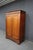 Classic Louis Philippe style armoire attributed to National Mount Airy, crafted in warm cherry with clean paneled doors, a...