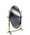 An elegant, vintage swivelling table mirror, crafted with a refined solid brass frame. Its slender silhouette is...