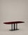 Sculptural dining table in smoked black epoxy resin and ruby ​​red mica A magnetic table, conceived as a sculptural...