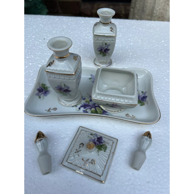 Up for consideration is a beautiful collection of ceramic decorative vases and a tray with decorative purple flowers....