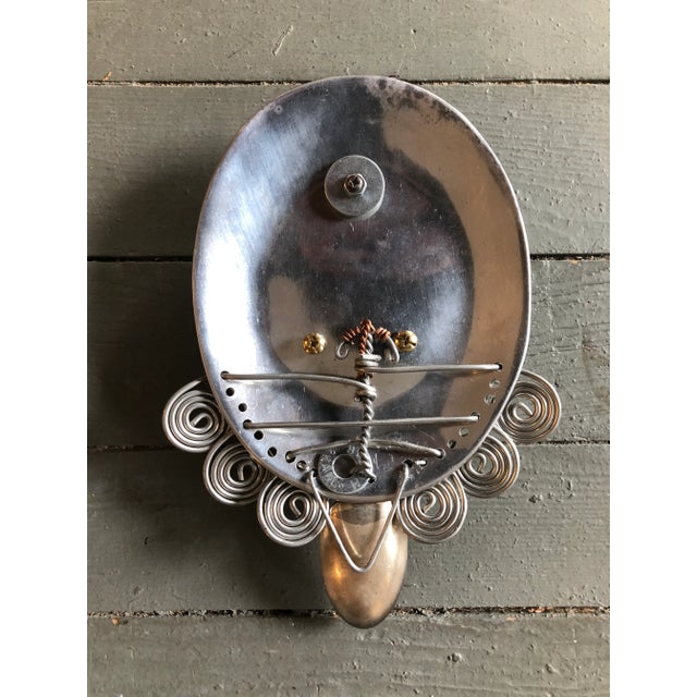 Original metal mask made from found objects 9.5 Hong x 7 wide 2 inches deep signed on metal ring on reverse Ready to hang!