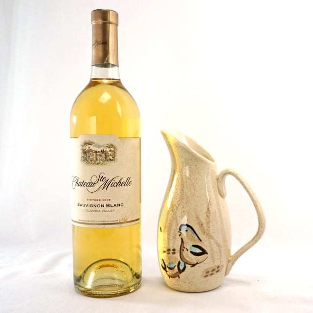 A fun and decorative small pitcher or creamer by Redwing with has a hand painted modernist quail design. The molded...