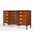 Elegant curves and timeless proportions define this mid century Federal-style triple dresser by Dixie. Crafted in rich...