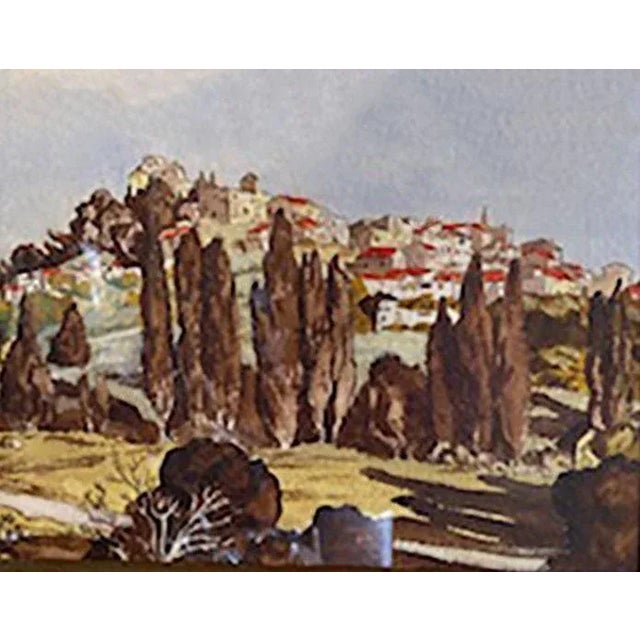 A 19th century French watercolor of a hillside village. Framed, under glass.