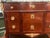 A beautiful mahogany commode from the late 18th century. It has a rich green antico verde break-fronted marble top that...