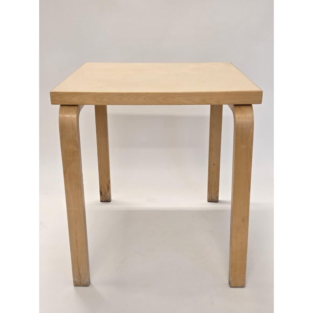 Artek table, birch with cream linoleum. Designer Alvar Aalto. The table is from around the 1960s. A few extra holes in the...