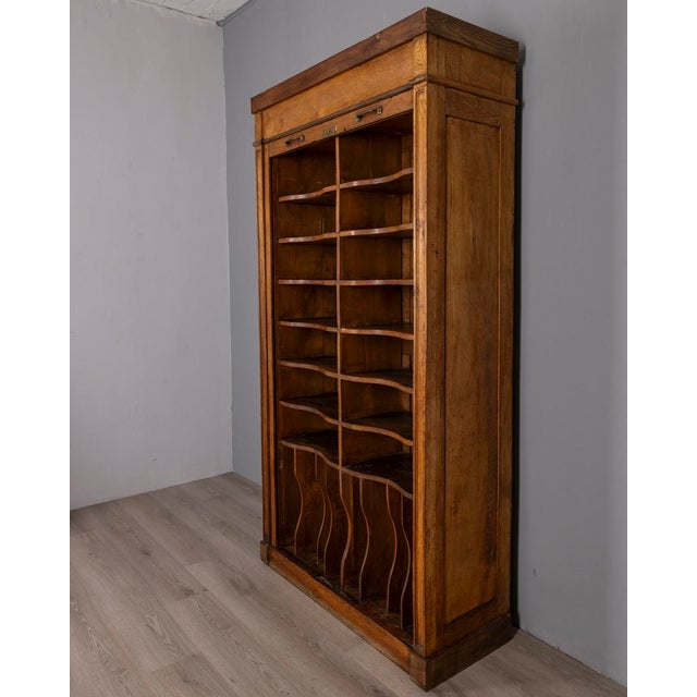 Rolling shutter filing cabinet, wooden structure with 14 upper compartments and 8 lower compartments, gold-plated brass...
